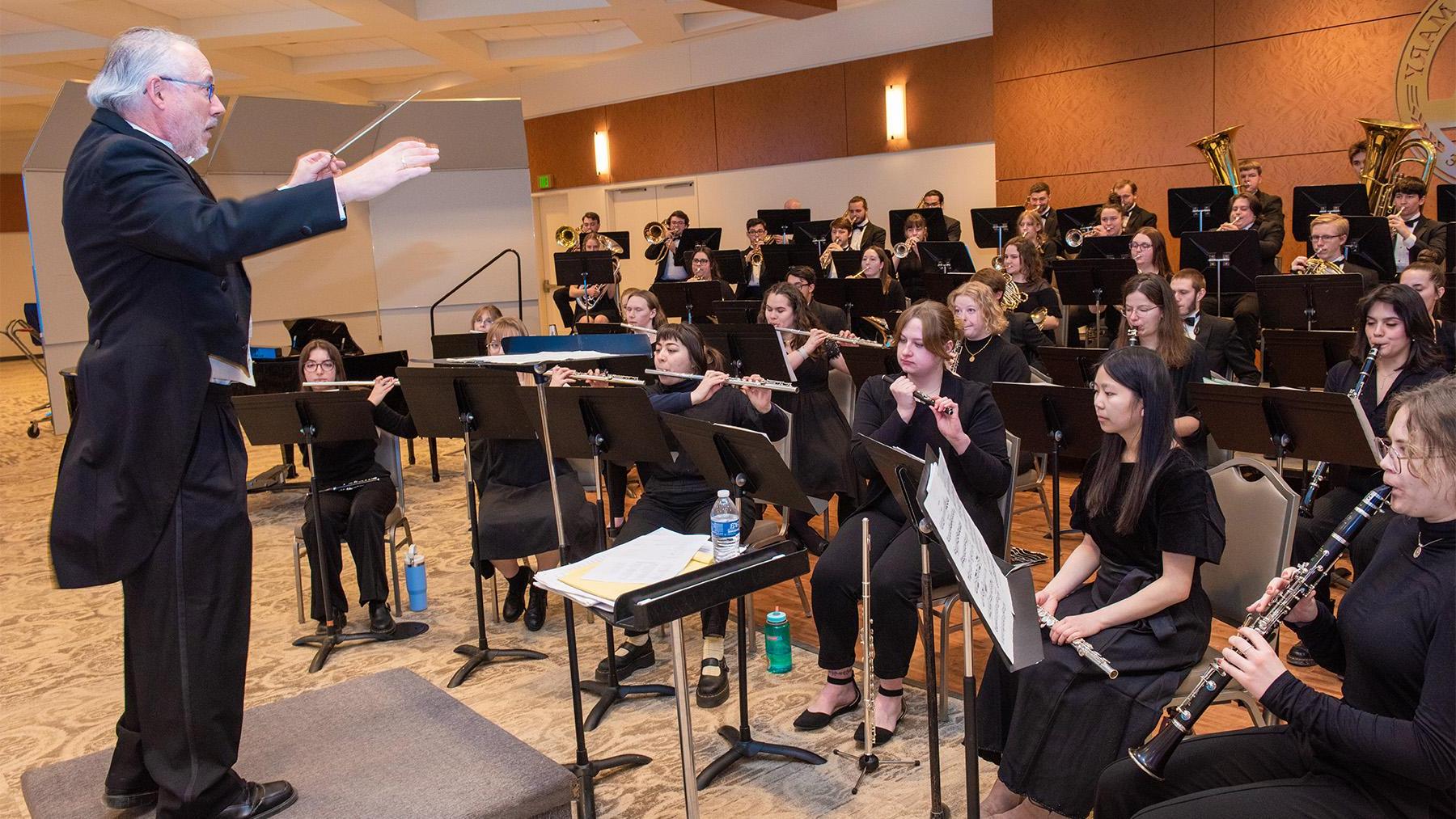 Denis Gowen conducting students in the Spring Concert.